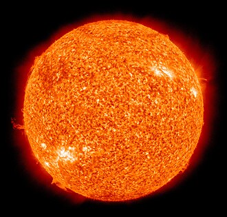 The Sun, its surface a mottled, intense orange